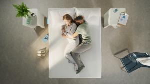 Image of a woman and man lying comfortably on a Simba Mattress