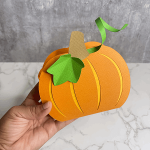 Bright orange Carrot American Crafts 12x12 Cardstock ideal for crafting, scrapbooking, and creative paper projects.