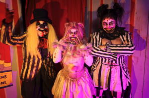 Molly, Patches and Trixx in full costume at Nightmare Village haunted house, interacting with guests.  I can also create 2–3 alternate captions and