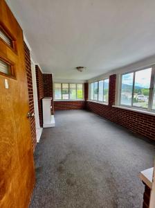 Well-built 2 BR/2 BA brick ranch-style home w/full walk-out basement on 1 +/- acre lot in the Cloverdale area of Botetourt County, VA. The home measures 2,464 +/-  gross sf. (1,232 +/- sf. finished on main floor & 1,232 +/- sf. unfinished basement).