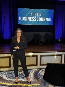 Paige Velasquez Budde, CEO of Zilker Media, hold her award at the Austin Business Journal Best CEO Awards in Austin, Texas.