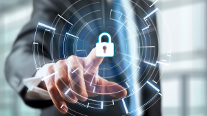 A man's hand touches a digital lock in the center of a graphic digital system overlay.