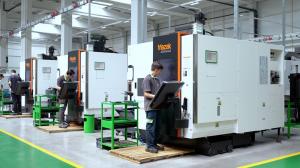 Workers using  CNC machining centers inside Simsek Makina Takim factory for precision manufacturing.