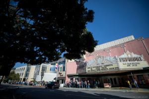 Exterior of vintage Fremont Theater in San Luis Obispo, California with people lined up out front