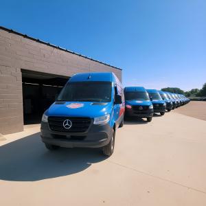 New All Fleet mobile repair vans lined up outside a service center, ready to provide 24/7 roadside repair and preventive fleet maintenance across the country.