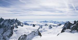 Snowy mountain landscape representing conscious and sustainable luxury travel with Axonall