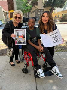 Xavier Young, the young Altadena teen joined by Maxine Moshay of Exceptional Children's Foundation and Angela Belty of Los Angeles Trial Lawyers Charities (L-R: Maxine Moshay, Xavier Young, Angela Belty)