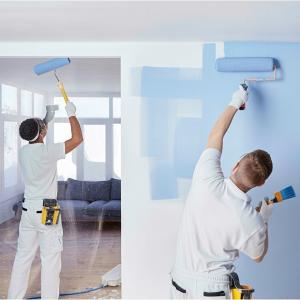 TampaBayHandymanServices.com Crew performing interior painting in a Tampa living room, walls and trim.