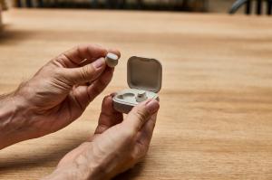 wave lite hearing aids on hands