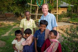 Pastor James Smith drilling a water well in West Bengal, India, with former orphaned children now part of the Opportunity Hope orphanage.