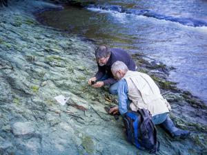 Dr Paul Scofield and amateur palaeontologist Leigh Love examine a section of riverbank on the Waipara River, near where the Protodontopteryx fossil was found.