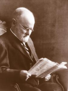 Black and white photo of the founder of the Jones Dairy Farm in a chair