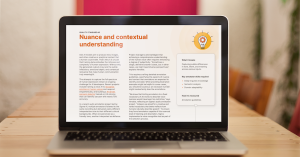 Whitepaper for new quality gen AI standards shown on a Mac laptop.