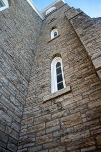 A restored heritage stone façade in Ottawa, showcasing Royal Canadian Masonry craftsmanship in structural and historical building preservation.