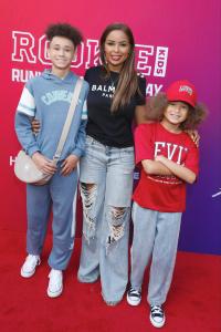 Noah Walker hits the runway in a red Levi's shirt ,matching cLinda Jasmine Walker, Noah Walker, and Sam Walker attend the Rookie USA X Macy's Fashion Show in New York City September 18, 2025