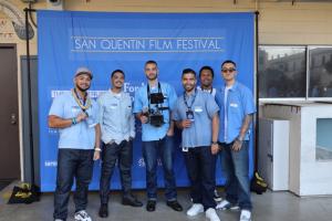Incarcerated still photographers and videographers from the San Quentin Media Center pose for a group shot.