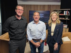 Mark Green stands with Signature Required hosts, Spencer and Carli Patton.