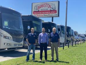 Founder Harrison Bankston, President Chase Baerlin, & Vice-President Colin Baerlin stand outside Huntsville, AL Bankston Motor Homes RV Dealership