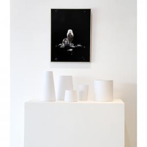 This is a photo of a painting by Linda Cosgrove of a monkey sitting with vases designed by Barbara Barry