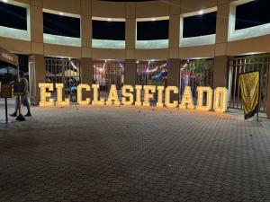 Sign of El Clasificado outside the Su Socio de Negocios Expo