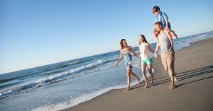 Family walking along the beach.