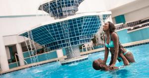 Couple at a swimming pool.