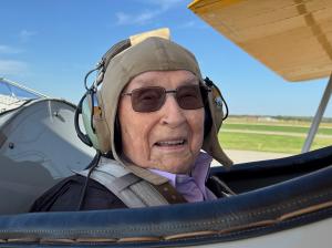 Army veteran and WWII hero Jim Sharp, 101, smiles after receiving a free Dream Flight from nonprofit Dream Flights at the Kansas Jet Center on Sept. 27, 2025. Sharp fought in the Battle of the Bulge during World War II and later served as Sergeant Guard a