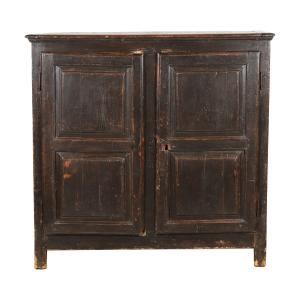 Early 18th century French Louis XIII low armoire in fine condition, constructed in butternut with deep brown panels, original shelves, old brown paint. Estimate: $15,000-$25,000 (Canadian).