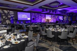 Wide view of the Inn Key Awards 2025 venue in Downtown Miami, filled with guests and hospitality showcases.