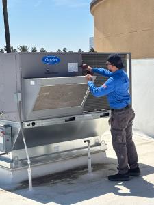 Mechanical Air HVAC technicians working on a hvac unit in Fresno, California, providing expert maintenance and repair services.