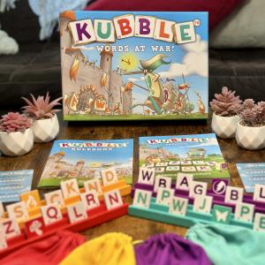 Solid wood vibrantly colored word game pieces and puzzle book.