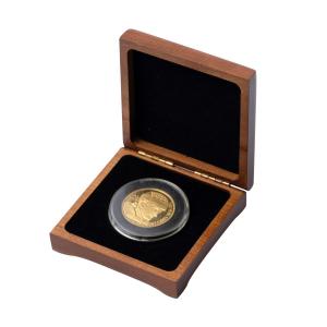 0.9999 pure gold Wayne Gretzky coin, #52 from a mintage of 99 (the number The Great One wore on his jersey), 1.25 inches in diameter and in the original box (CA$5,605).