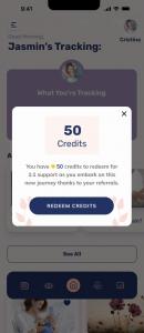 Screen shows a pop up within the app of a user receiving credits for a referral.