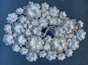 Large Buccellati sterling silver 925 gardenia centerpiece with the original box, never used, inspired by nature and weighing 94 ounces Estimate: $18,000-$20,000.