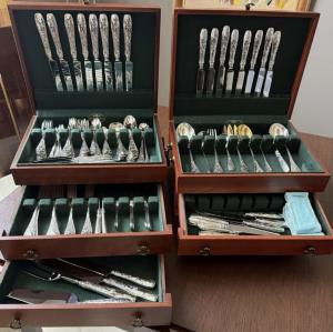 141-piece Tiffany & Co. sterling silver flatware set in the Audubon pattern, showing little if any previous use, in two wooden chests with green interior. Estimate: $30,000-$35,000.