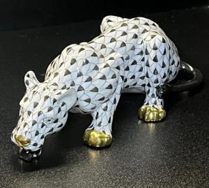 Large Herend drinking lioness figurine with 24k gold accents, sleek and hand-painted in black fishnet. Estimate: $750-$900.