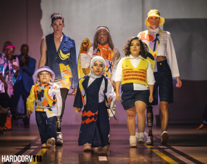 Adaptive clothing designer, Muroj Negha, debuts her cutting edge line in the 2024 Skin I'm In Fashion Week, showcasing diverse models with disabilities. Shown are amputee models, models with dwarfism, and more.