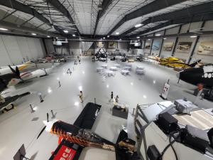 Skin I'm In Fashion Week 2025 to be held at iconic Lone Star Flight Museum, Houston, Texas. Shown is an image of the building showing wide open spaces, aircraft of different eras, and an elegant display