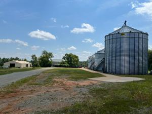 Highlights of the property include frontage on the South Anna River, frontage on Ambler and Shannon Hills Roads, crop land, forest and woodlands, two (2) homes, several large shops/storage buildings, grain bins and drying systems and a central VA location