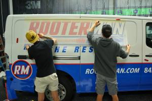 The Carolina Wraps team branding the new service van