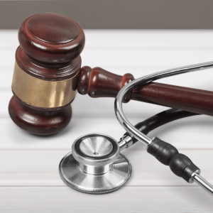 Wooden gavel and stethoscope