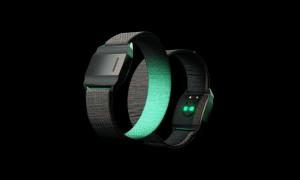 ReflexDAO prototype wristband with a soft black strap and green optical sensors, designed to sync with the Reflex app for everyday health and wellbeing tracking.