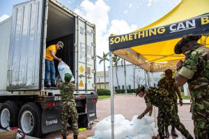 Scientology Volunteer Ministers help get food ready and loaded into trucks