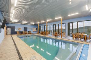 Indoor Pool Guest House with Wall of Sliding Glass Doors