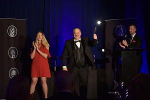Richard Tyler receiving an EXPY® Award for excellence in speaking, writing, and media.