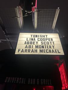 A nighttime photo of the Universal Bar & Grill marquee with Farrah Mechael’s name lit up alongside other performers, representing her rise as a featured live artist.