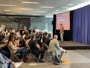 URI startup founder presenting a pitch to an audience of investors and community members during the inaugural Tech Showcase.