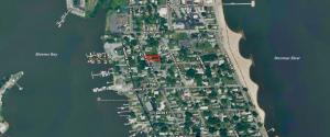 4 BR/2 BA home on .16 +/- acre town lot in the Town of Colonial Beach, VA--nestled between Monroe Bay &. The Potomac River. The home has one bedroom & one bathroom on the main level, 3 bedrooms & one bathroom on the upper level, and features a kitchen w/breakfast nook