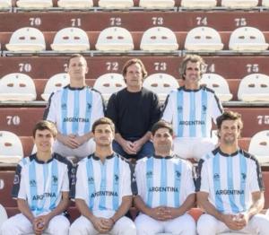 7 male polo players face camera
