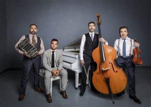 four argentinian tango musicians posed with their instruments